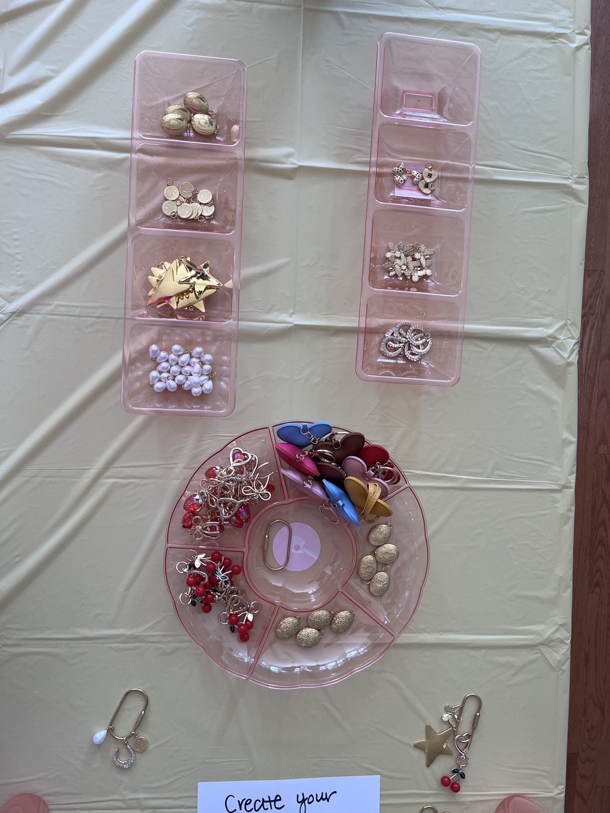 Charm bracelet DIY station with trays of charms